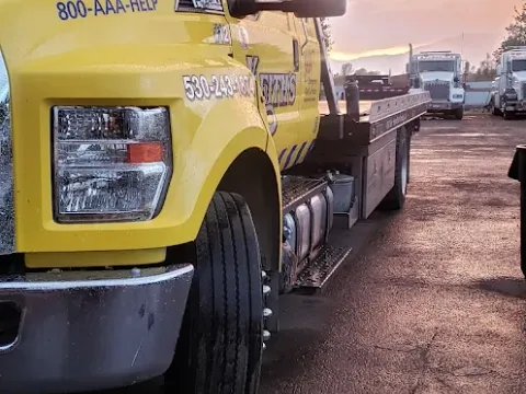 Keith's Towing truck at sunset