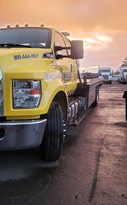 Keith's Towing truck at sunset