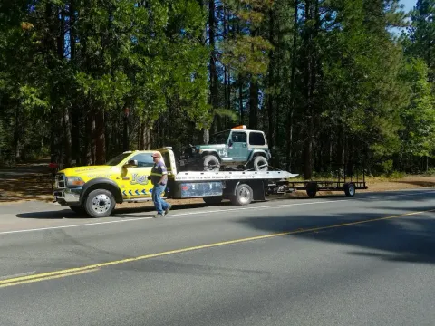 Keith's Towing flatbed tow truck ready for dispatch
